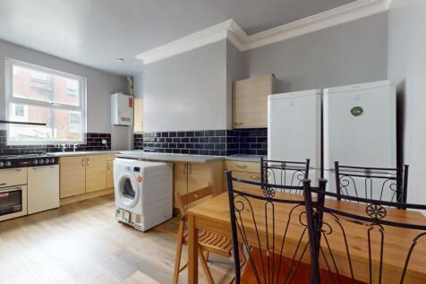 Bright and tidy kitchen with natural light, fea...