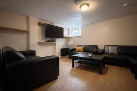 Social lounge with large TV and leather sofas...