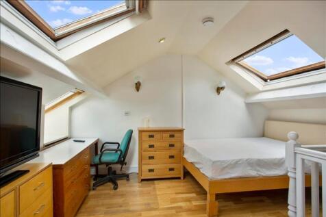 This charming double bedroom features ample nat...