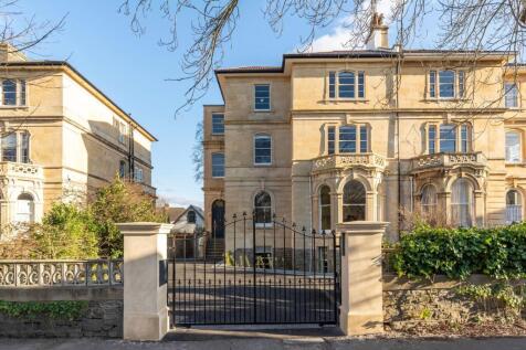 Stunning historic stone building with grand gat...