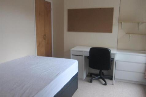 Tidy bedroom with ample storage and study desk...