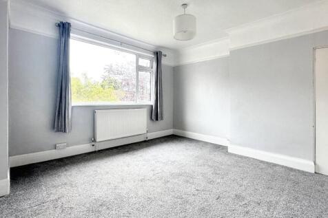 Bright and spacious room with a large window...