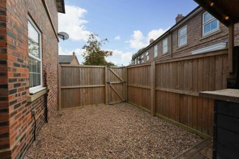 SIDE GRAVELLED AREA