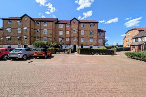 Spacious exterior with parking and bright skies...