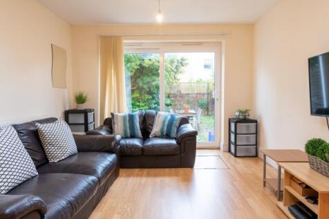 Bright and inviting living room featuring comfo...