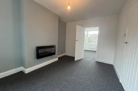 Lounge with door to Bedroom