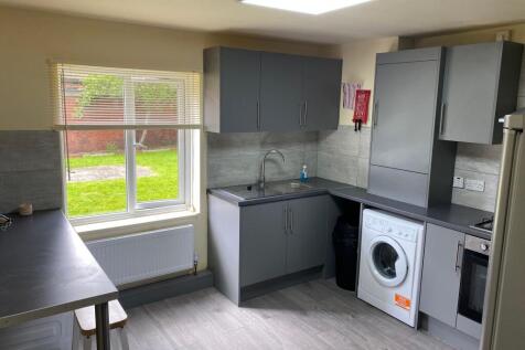 Modern and functional kitchen with ample natura...