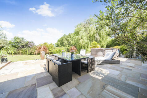 Large rear Indian sandstone terrace providing plenty of space for an array of outside seating