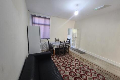 Simple, neutrally decorated living room with a ...