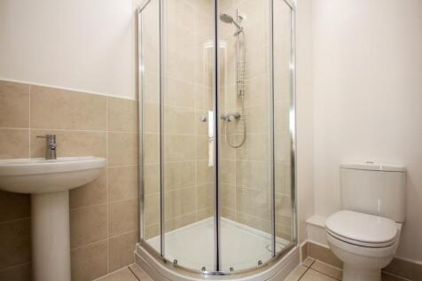 A modern and pristine bathroom featuring a styl...