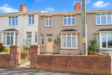 Sunny British Terraced Houses with Wrought-Iron Ga