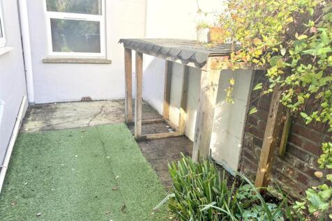 Private courtyard garden with sheltered storage...