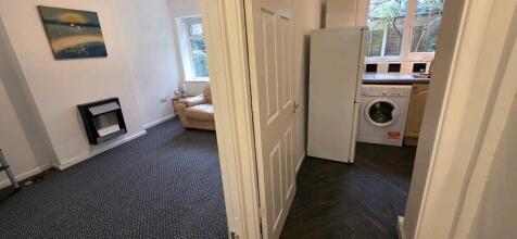 Bright living area with adjacent kitchen space...