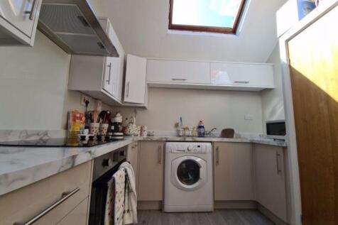 A modern, well-organized kitchen with ample cou...