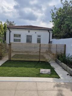 Private outdoor garden with lush green lawn...