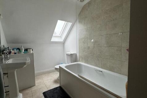 Bright bathroom suite with natural skylight...