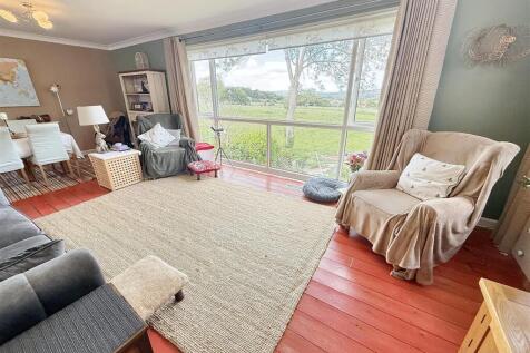 L Shaped Lounge through Dining Room