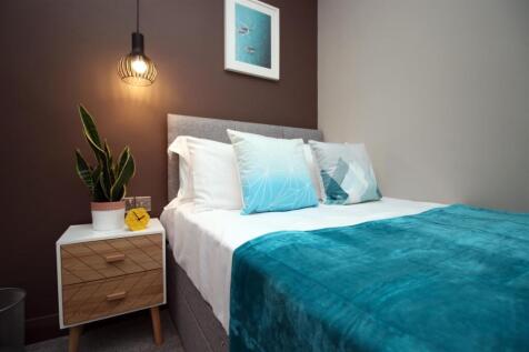 Stylish double bed with modern bedside table...