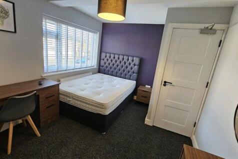 Bright, modern bedroom with a comfortable doubl...