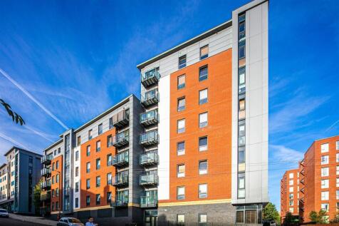 Modern apartment building with sunny balconies...
