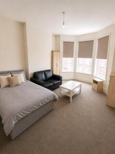 Bright master bedroom with large bay window...