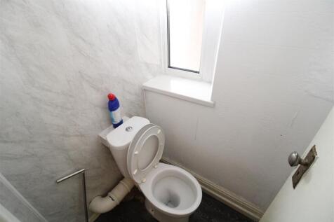 Bright and tidy modern toilet room with natural...