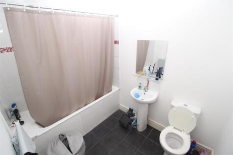 Bright bathroom suite with a full-sized bathtub...