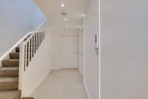 Bright and modern hallway with stylish lighting...