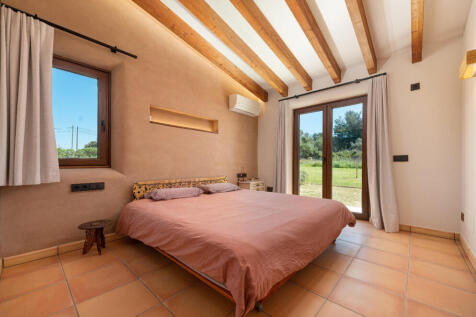 Master bedroom with direct garden access.