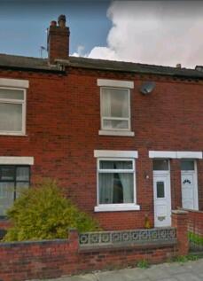 Red-brick terraced house with bay window and sm...