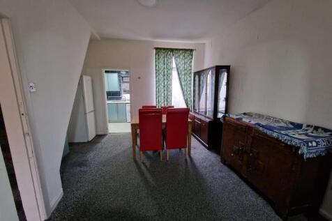 Spacious living area with large dining table...