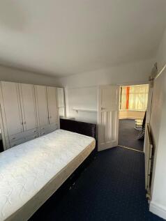 Bright bedroom with ample built-in storage...