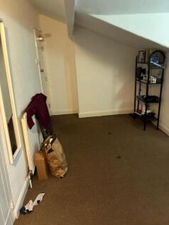 Bright and spacious room with handy shelving...
