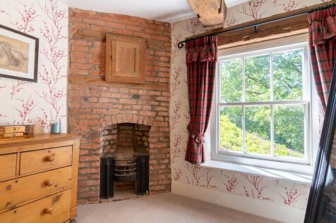 Separate dressing room with brick feature wall