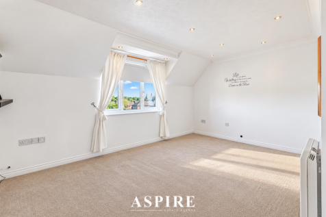 Bright Minimalist Attic Bedroom Viewing.png