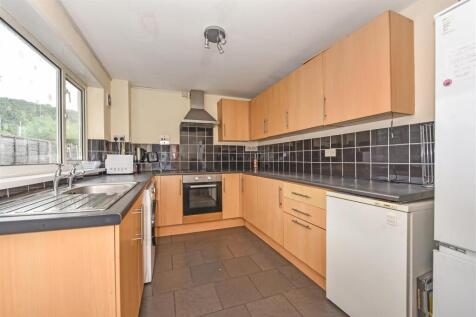 Bright kitchen with ample storage and workspace...