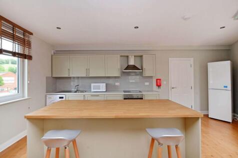 Modern and bright kitchen with ample counter sp...