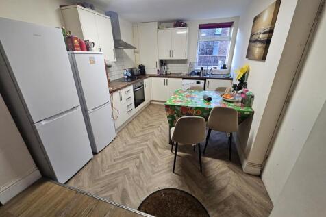 Bright, modern kitchen with fitted units, integ...