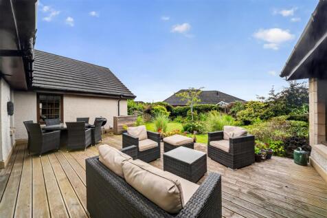 18 rear garden - decking area.jpg