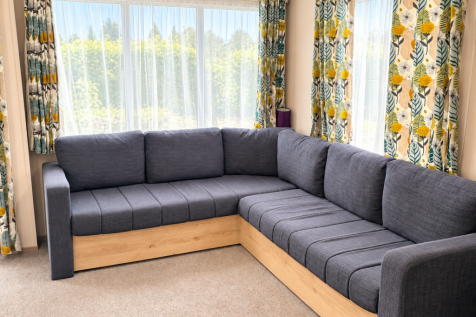 Bright Lounge With Spacious L Shaped Sofa And Larg
