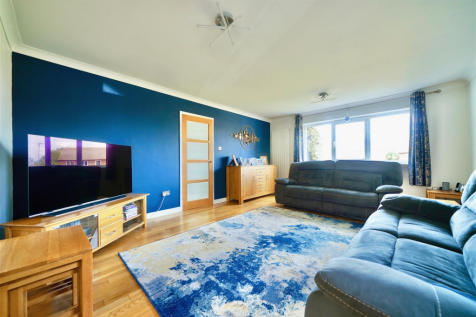 Lounge facing front of the property.png