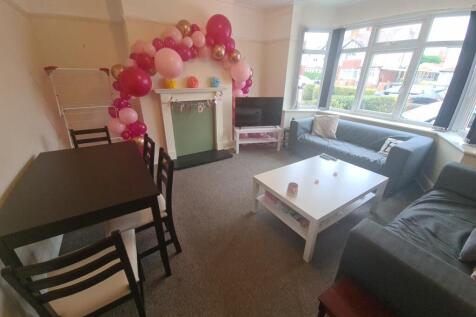 A cozy and well-maintained living room with amp...