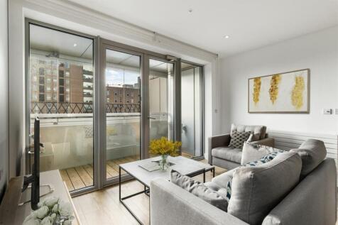 Experience modern elegance and comfort in this chic living space with a balcony view.