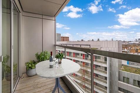 Experience urban tranquility with this stylish balcony offering breathtaking city vistas.