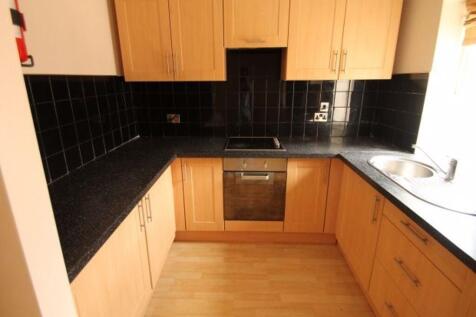 A neat and well-maintained kitchen with light w...