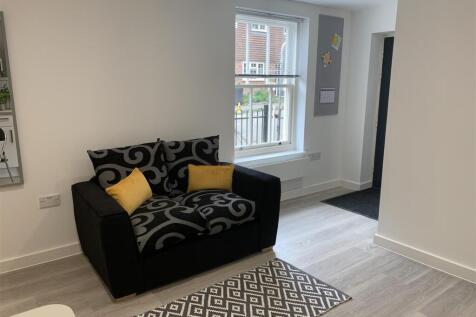 Bright modern lounge with stylish seating area...