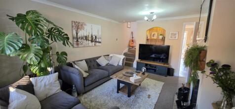 Sitting room with carpet flooring