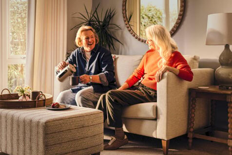 a person and a child sitting on a couch