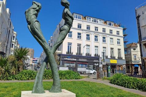 Statue and Front of Building