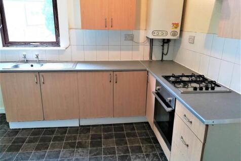 Bright kitchen with laminate countertops, gas h...